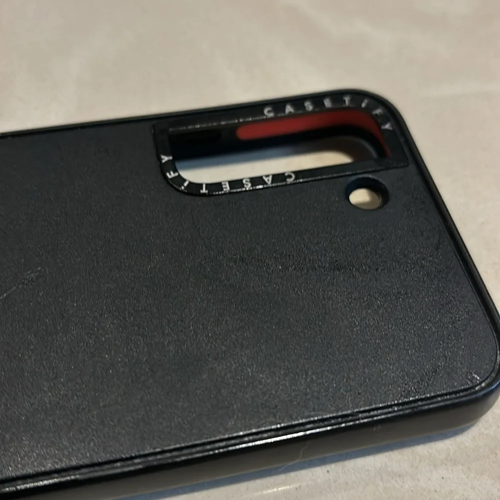 Two Samsung S22 Cases Casetify and Otterbox Black in color